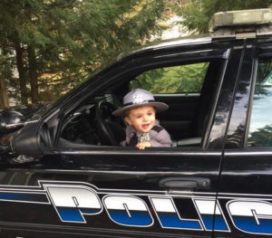 Everett in police car.