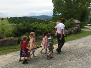 My husband walking with the kids.