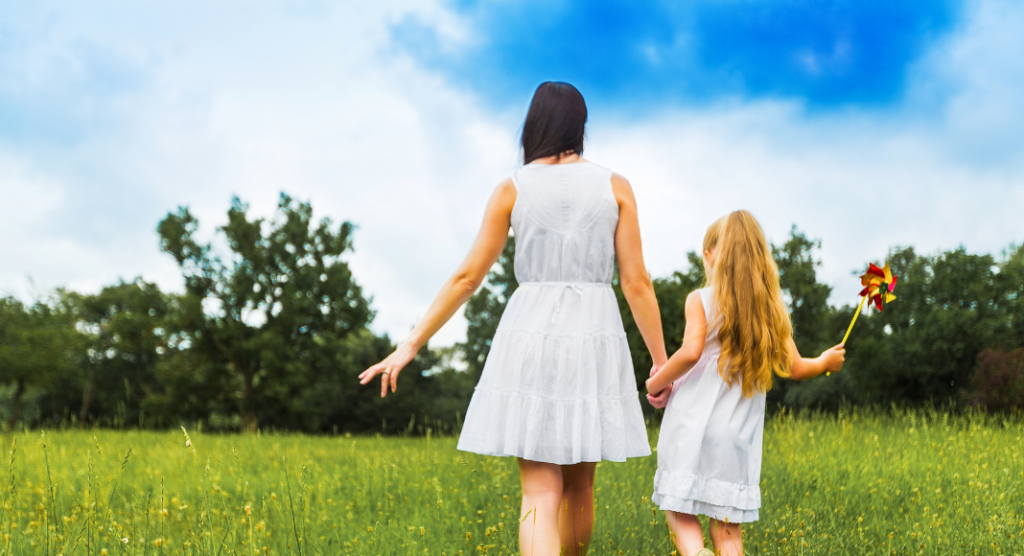 Mom with daughter in field -- relinquishing mom guilt
