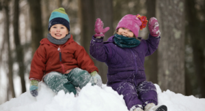 outdoor gear recommendations for kids - 2 kids in snow in gear