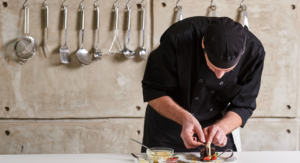 chef preparing food in a kitchen - Seacoast restaurants