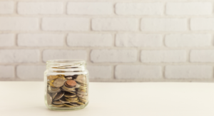 jar of coins - saving money with Seacoast family memberships