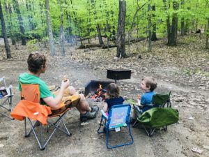 Dad and kids at campfire