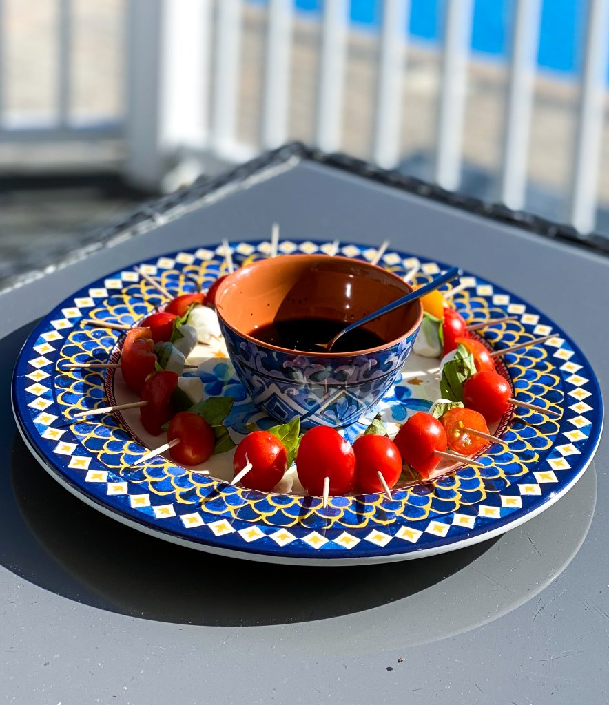 Caprese Salad on a platter - must haves for outdoor entertaining