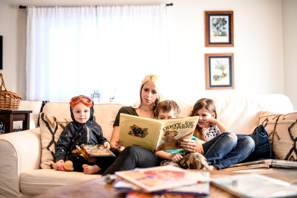 mother reading to three children -- homeschooling in new hampshire