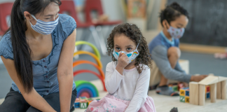 Does wearing a mask hinder a child's language development? child and caregiver in a mask