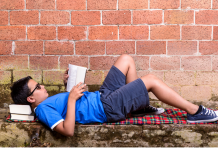 teen reading a book