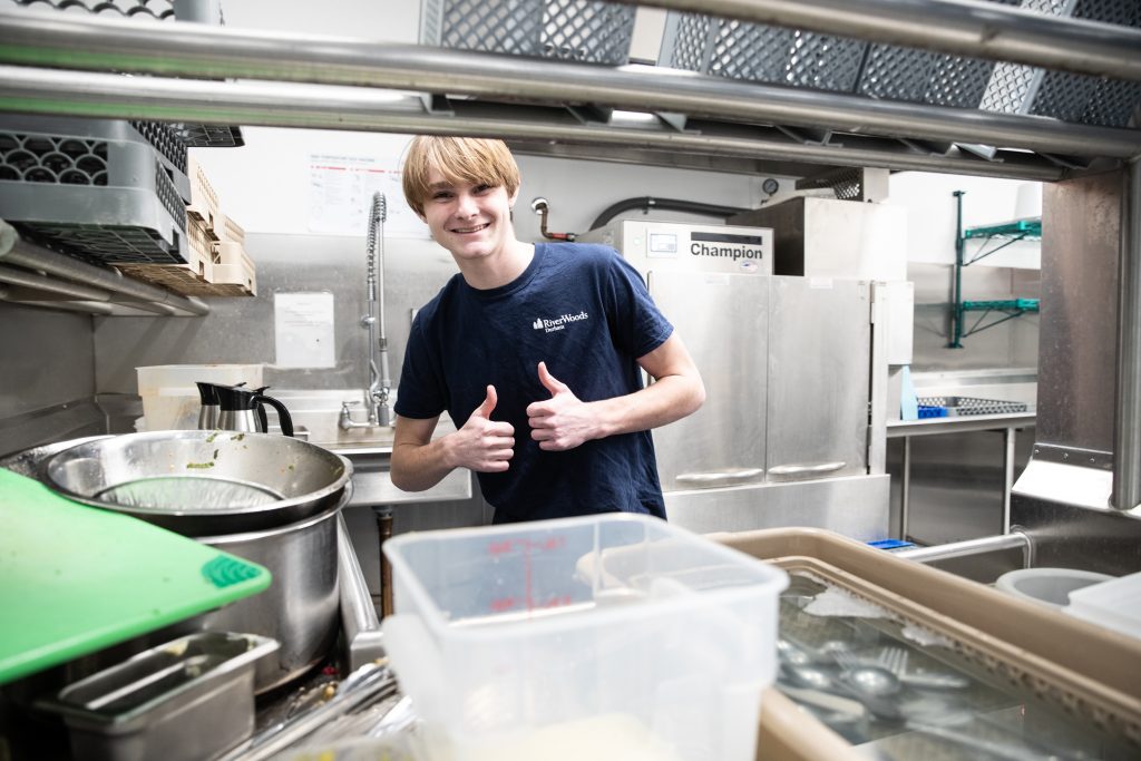 Job for Teens on the Seacoast - young man in kitchen at RiverWoods Exeter