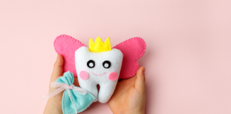 tooth fairy pillow in a childs hands