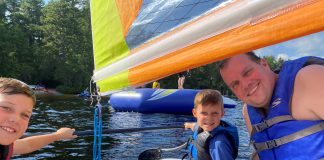 two boys and a dad sailing